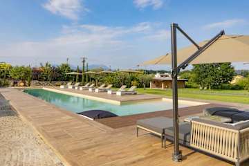 Swimming pool surrounded by sun loungers