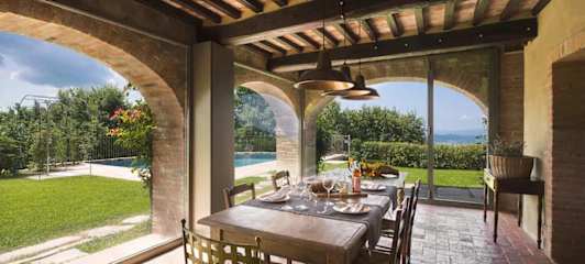 Dining table in a room with large arched windows