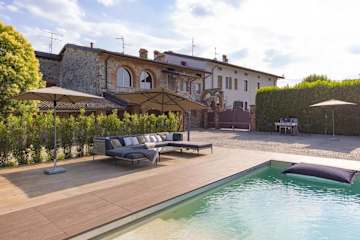 Sun loungers next to a pool