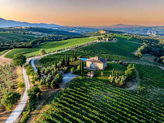 Italian villa on a hill in the middle of vineyards