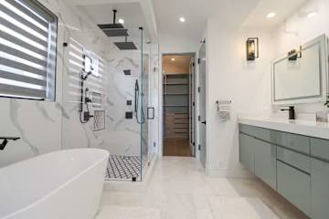 Master Bathroom with Tub and Separate Large Shower with multiple shower heads. Bathroom includes a bidet and spacious walkin Closet.
