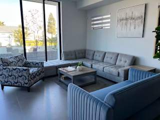 Elegant living room with chess set. Blue Sleeper for additional sleeping area.
