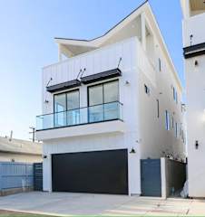 Rear of the home. Onsite parking for guest. Please park on the left side of the garage near the trash cans.