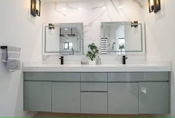 Custom Mirrors and custom countertops in Master Bathroom. The bathroom includes bidet, dual sinks and large walkin closet.