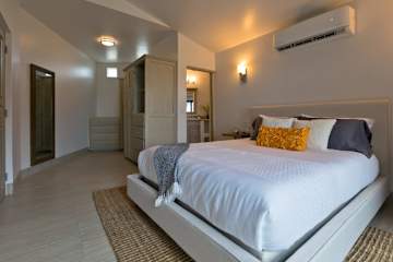 Upper Suite - Bedroom 1 with Ensuite Bathroom and Storage Closets