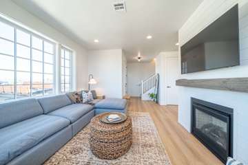Comfortable living room with fireplace and TV