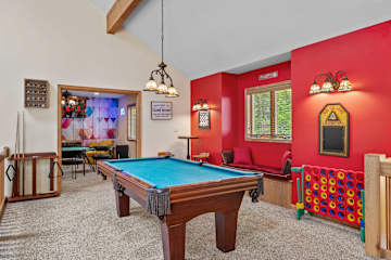 Rack ’em up on the pool table beneath bold red walls, just steps away from your next Connect Four rematch.