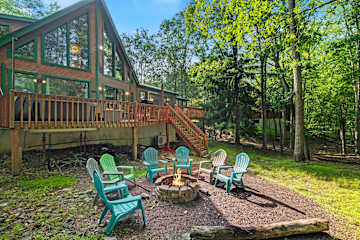 Outdoor Retreat: Gather around the firepit with colorful chairs for unforgettable moments under the stars!