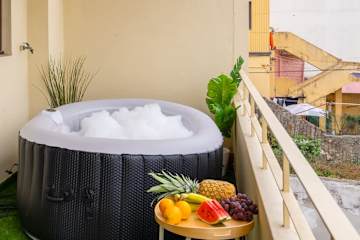 Two Trendy Bright Flats | Jacuzzi by HostWise
