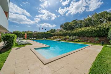 Sunlit Poolside Retreat w/ Balcony by HostWise
