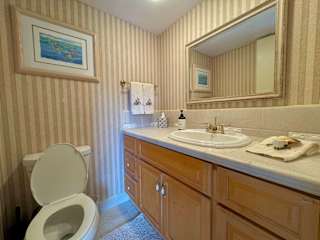 Fresh and simple toilet setup with vanity sink for a tidy start