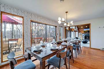 Gather around the stylish table with stunning woodland views—meals become memories!