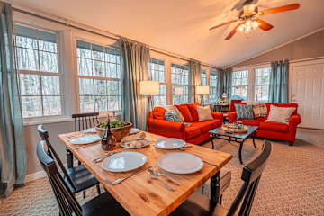 The perfect blend of comfort and style, featuring a chic dining table, elegant sofa, and Roku TV. Ideal for relaxation, entertaining, and enjoying meals with family and friends.