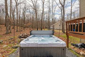 This luxurious hot tub is nestled among the trees, offering the perfect spot to unwind after a long day.