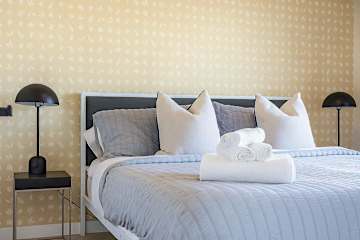 Cozy bed with soft linens