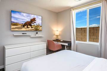 Bedroom 2 - Queen bed and dedicated workspace with desk and chair
