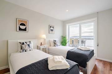 Bright Beachside Flat with Terrace by HostWise photo 5