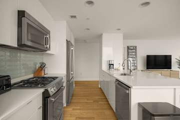 Photo #12 of Sutton Landing | 17th-floor 2BR w/Doorman, Gym, and Pool