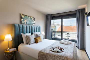 Panoramic Balcony Living by HostWise