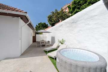 Relaxed Patio & Jacuzzi Flat by HostWise
