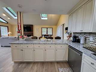 The kitchen island opens right into the dining and living space, making it easy to keep everyone connected while cooking.