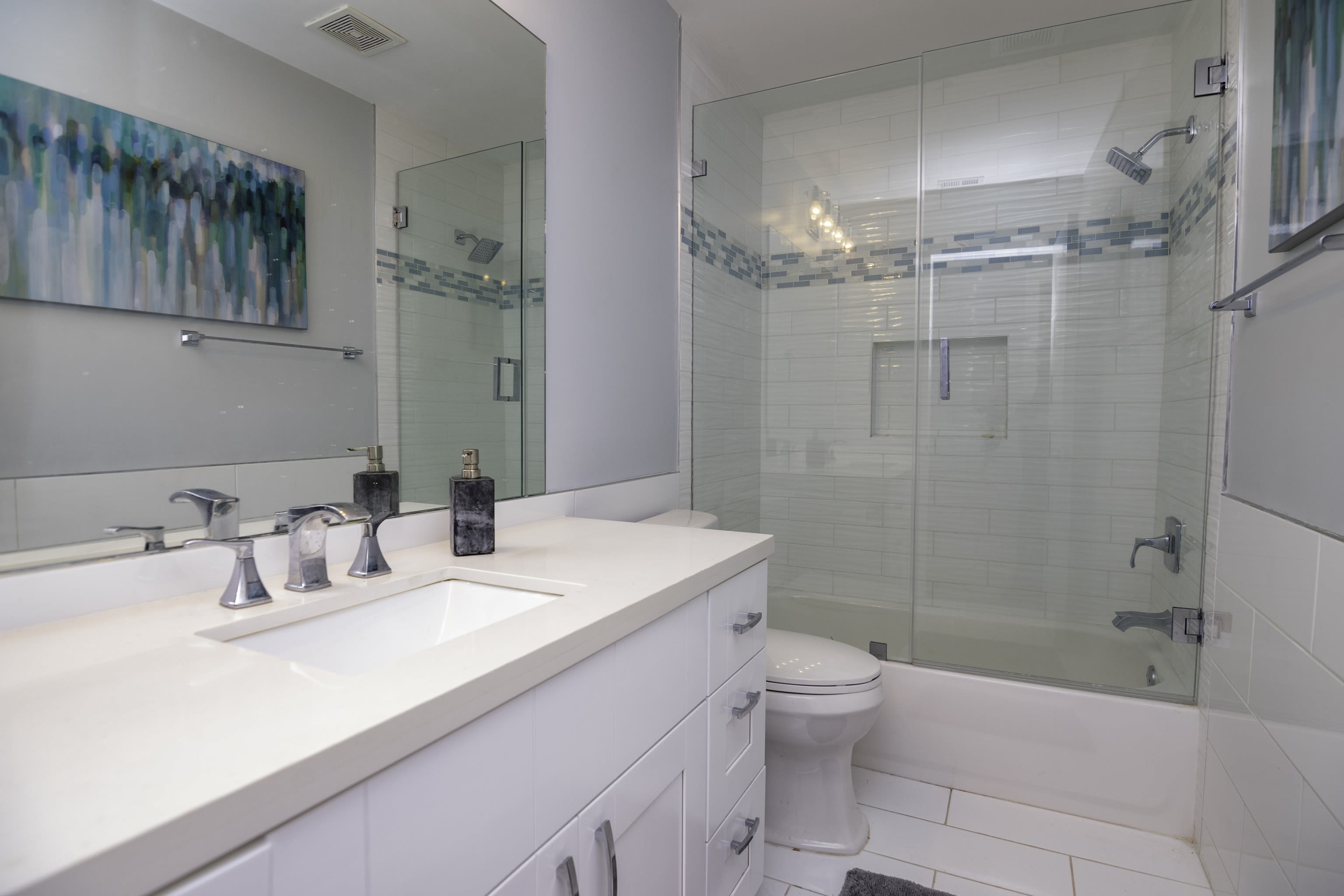 The second Full Sized Bathroom with A Shower and Tub Combo