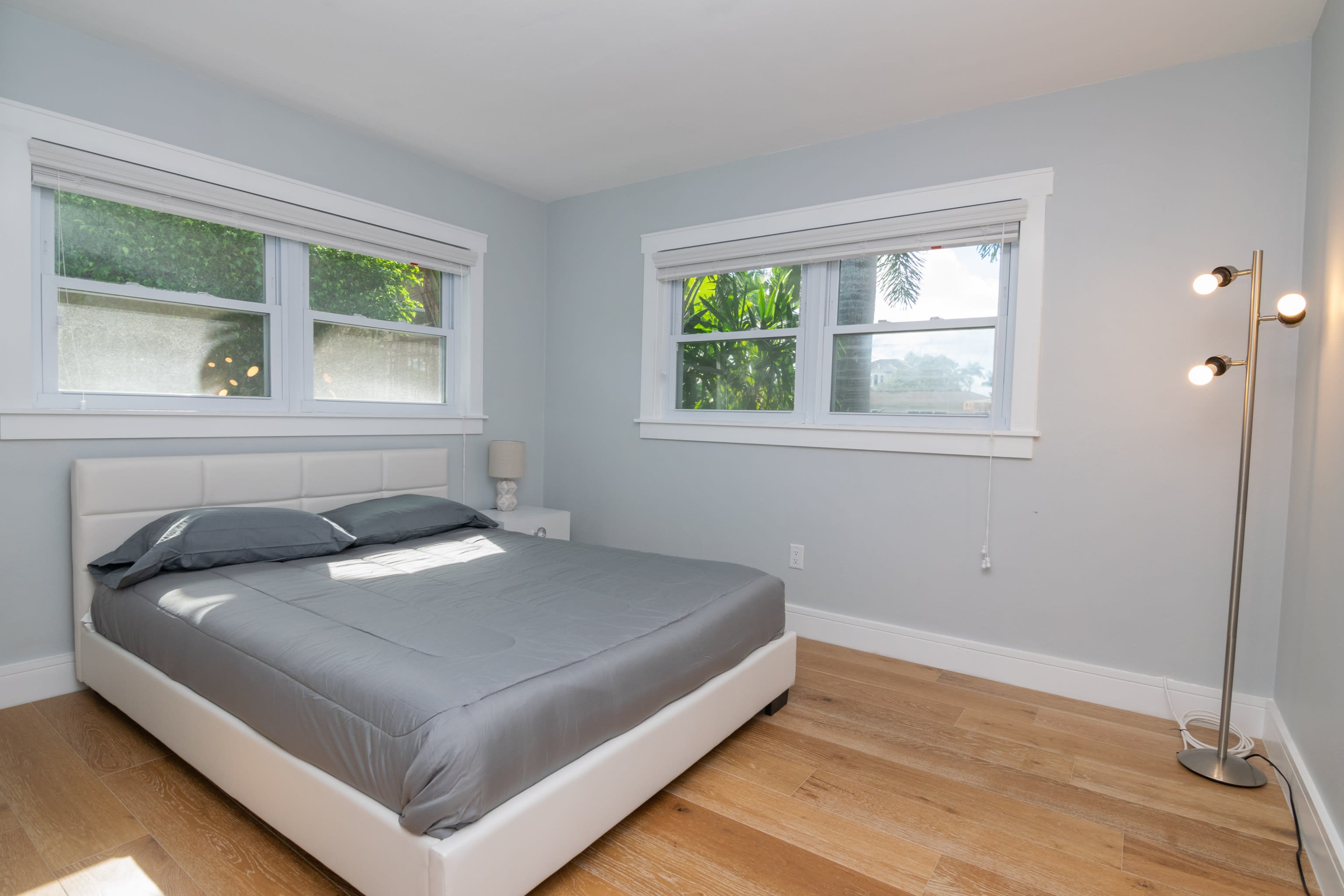 The Queen Bed in the Second Bedroom with Double Windows to Let in Lots of Light