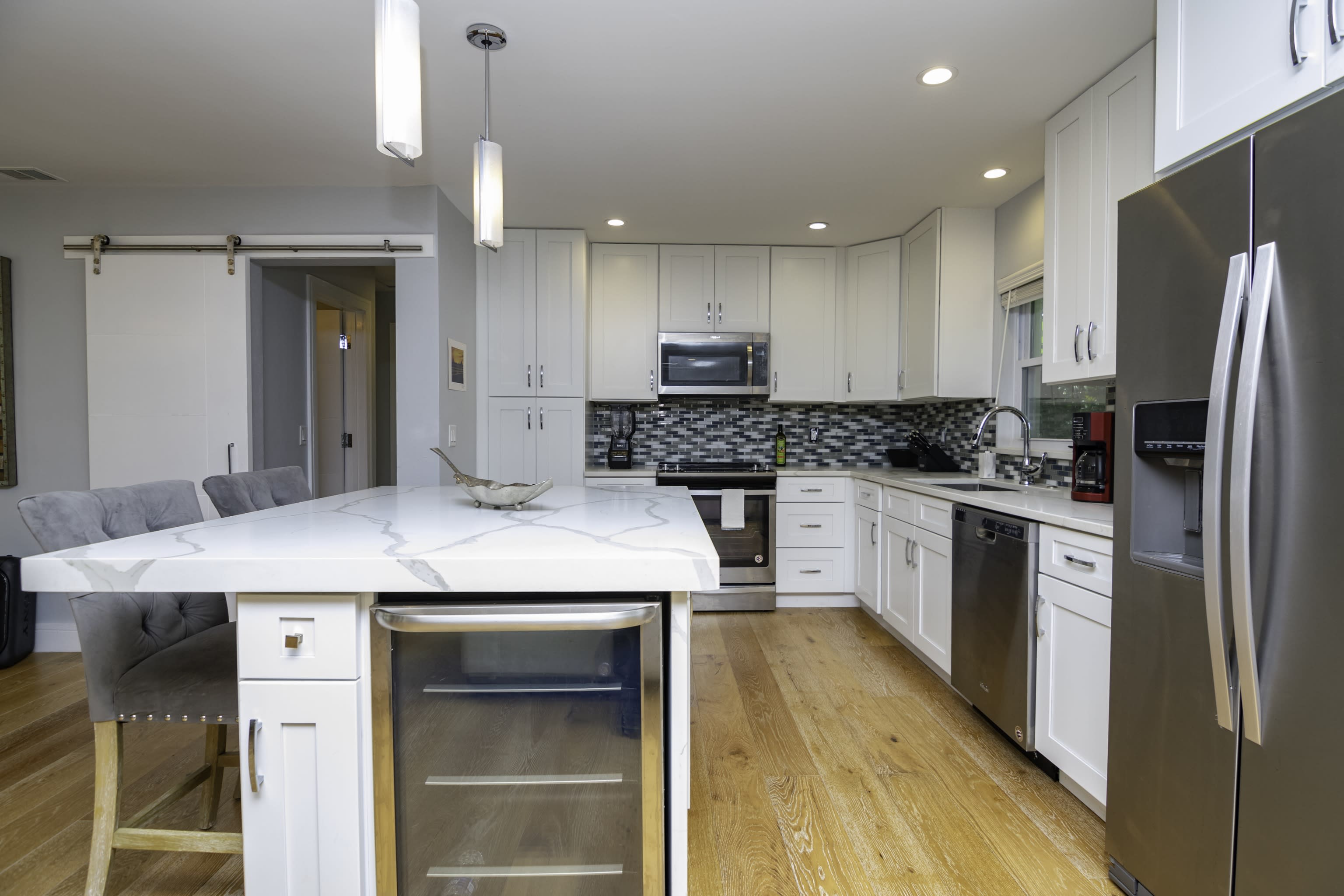 Enjoy the Use of the Wine and Beverage Fridge Along with Stainless Steel Appliances Throughout