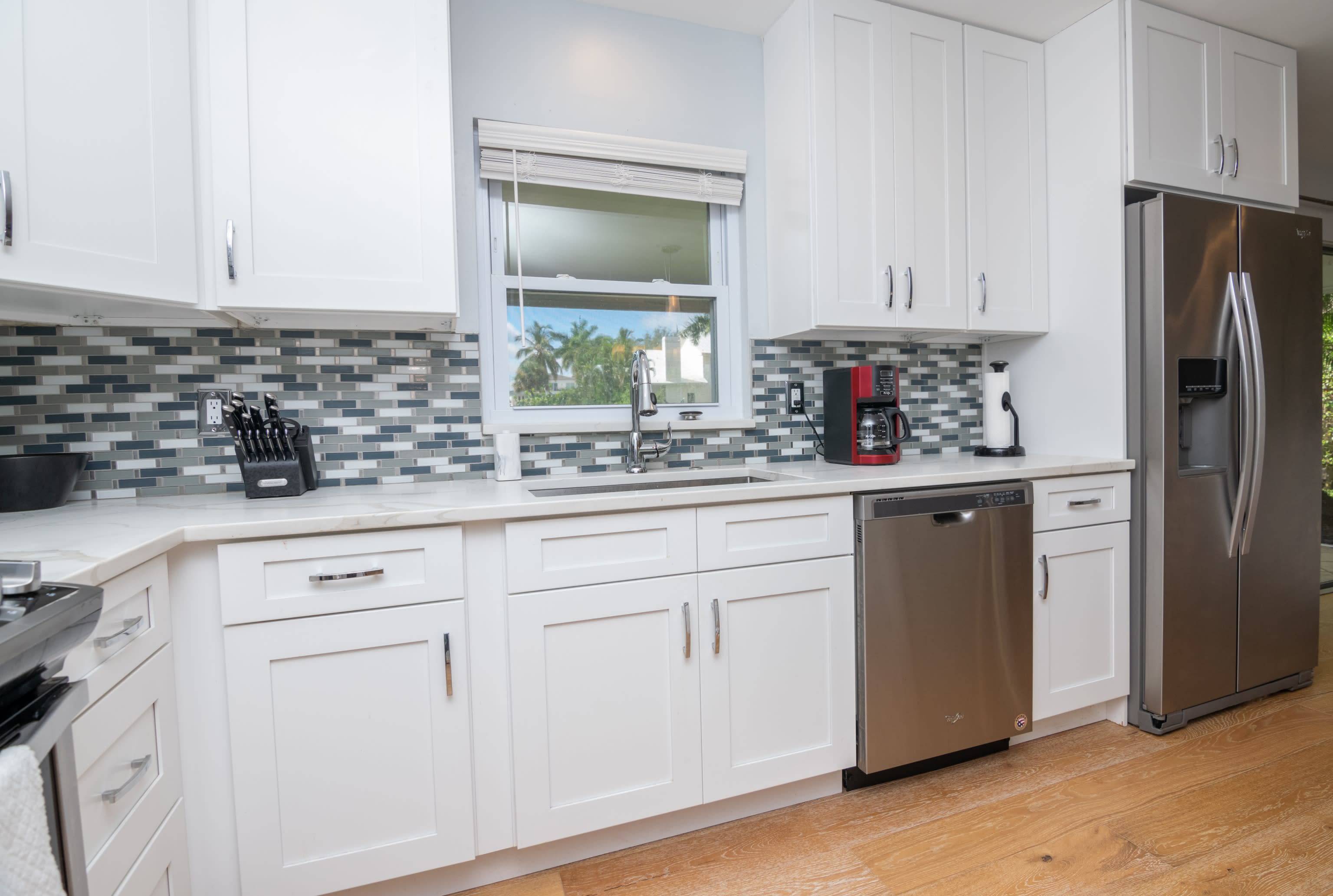 The Kitchen Has a Very Scenic View to the Backyard and Canal