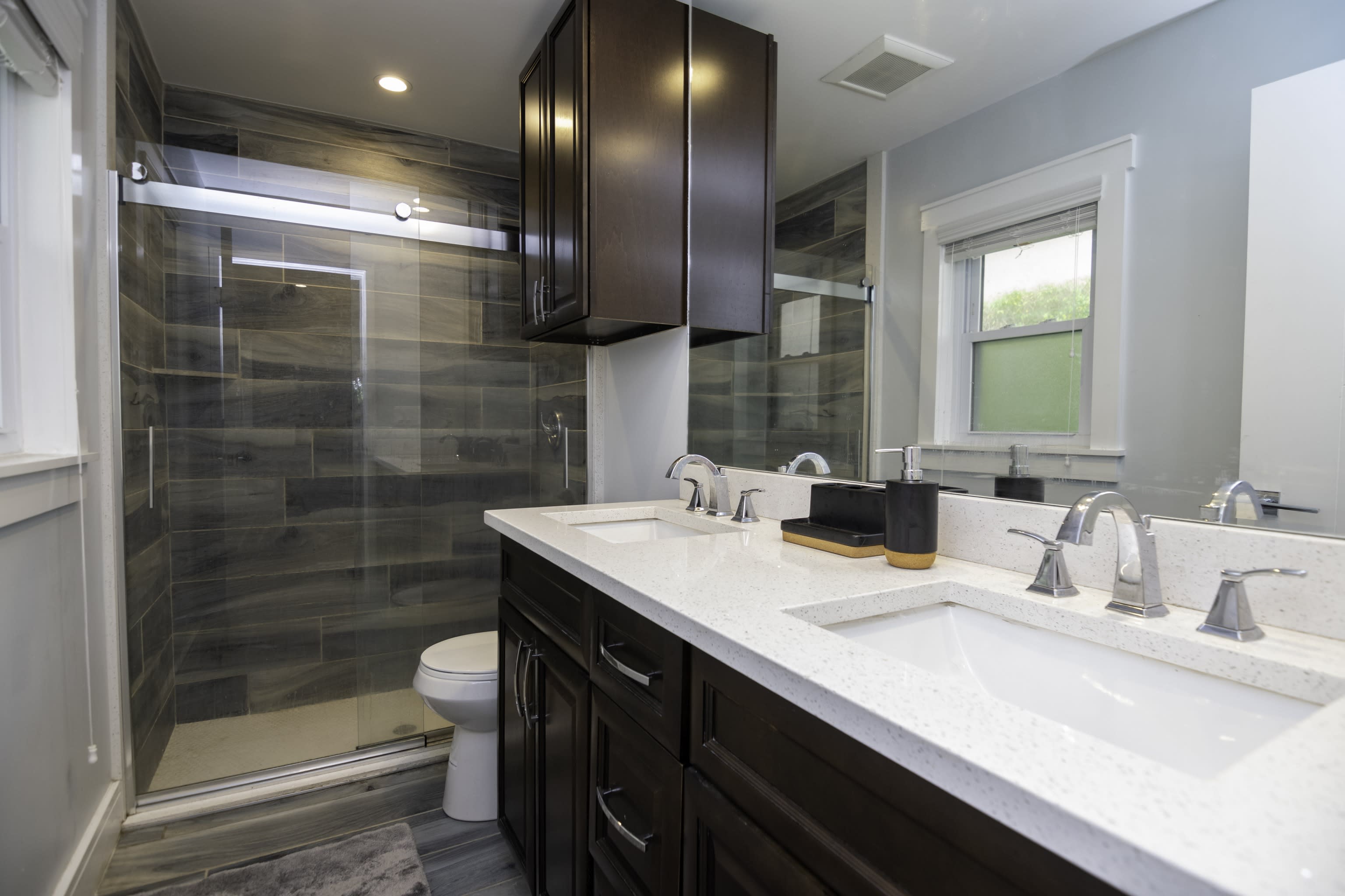 The Main Attached Bathroom with a Glass Enclosed Shower
