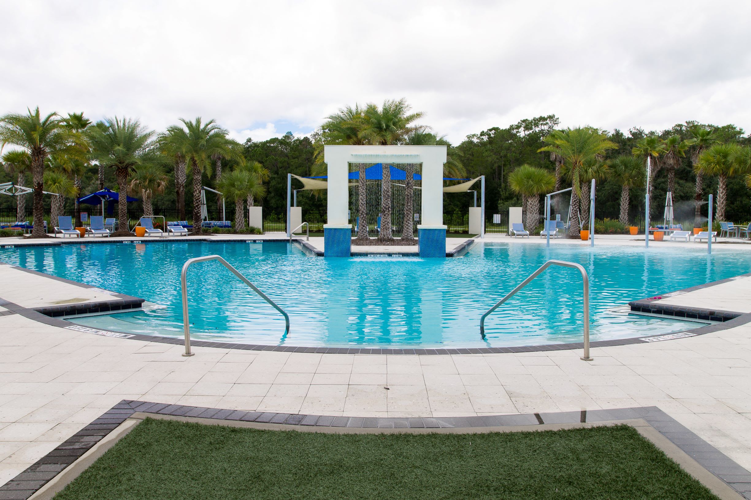 Relax By The Sparkling Resort-Style Pool Surrounded By Palm Trees
