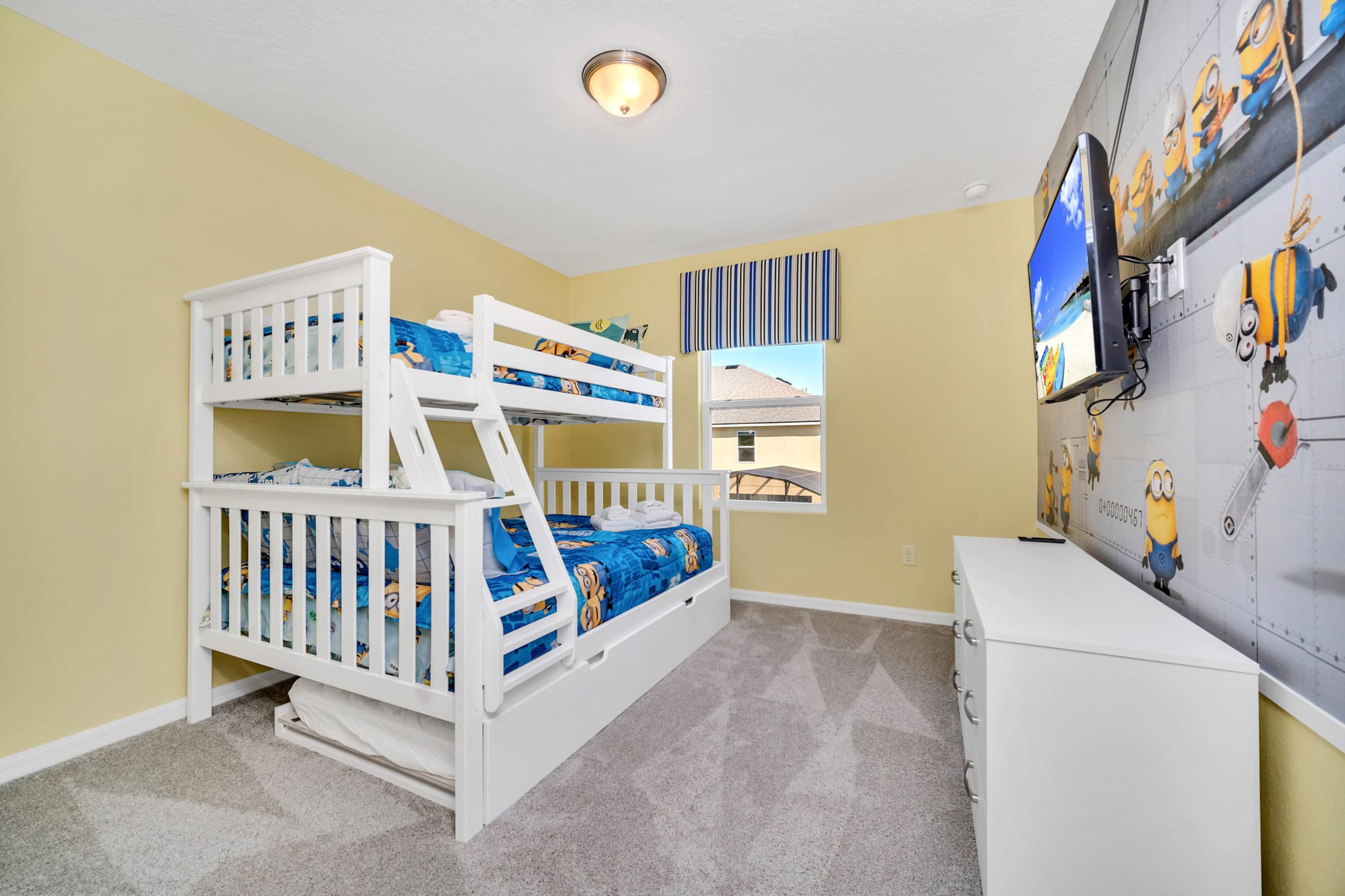 Minions-Themed Bedroom With Comfortable Bunk Bed Setup And Bright Decor
