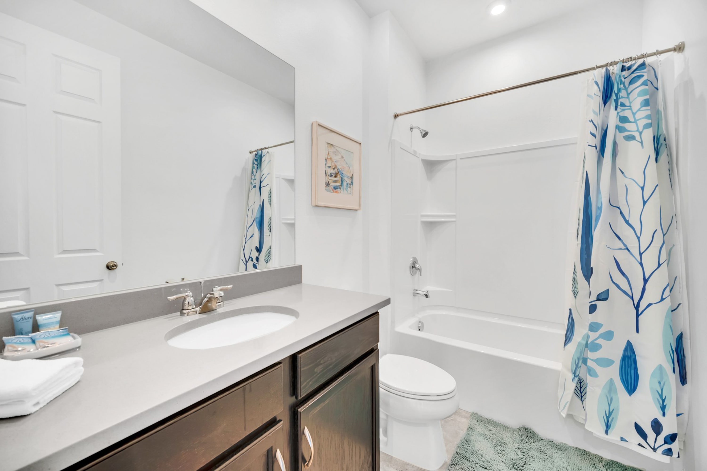 Modern Bathroom With Shower-Tub Combination And Elegant Fixtures