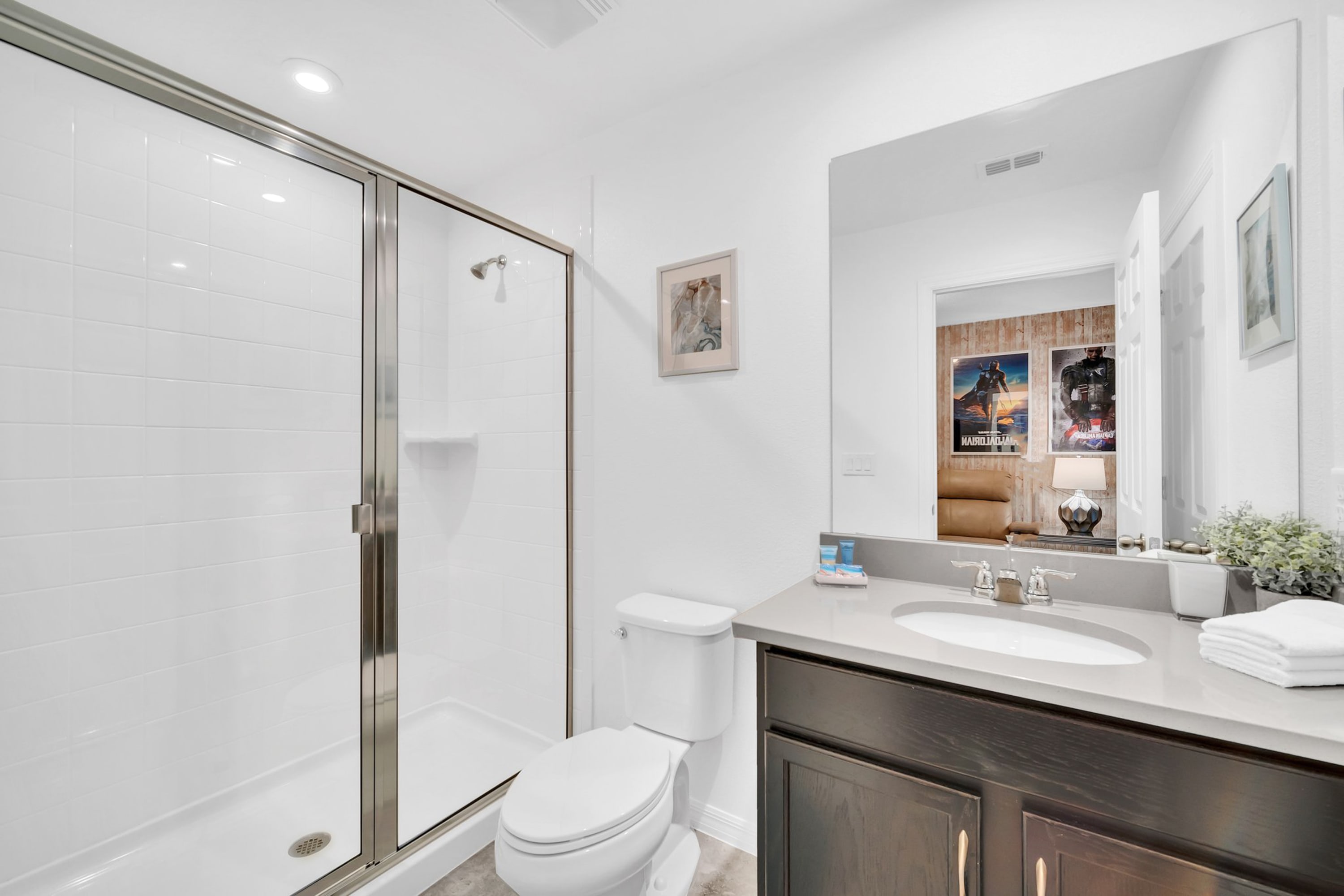 Sleek Bathroom Featuring Glass Shower And Contemporary Vanity