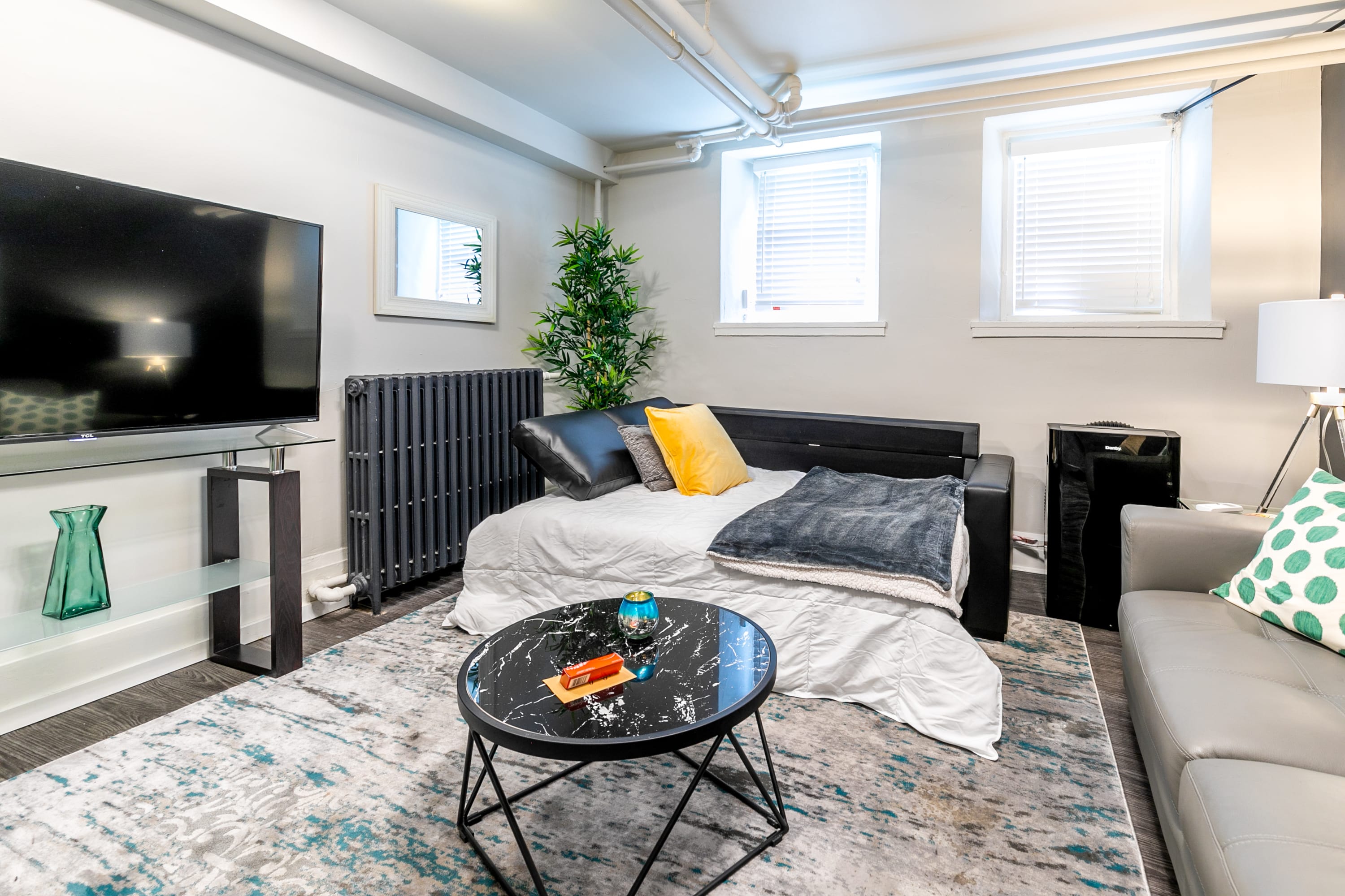 Spacious Lounge Area Featuring A Comfortable Sofa Bed And Smart TV
