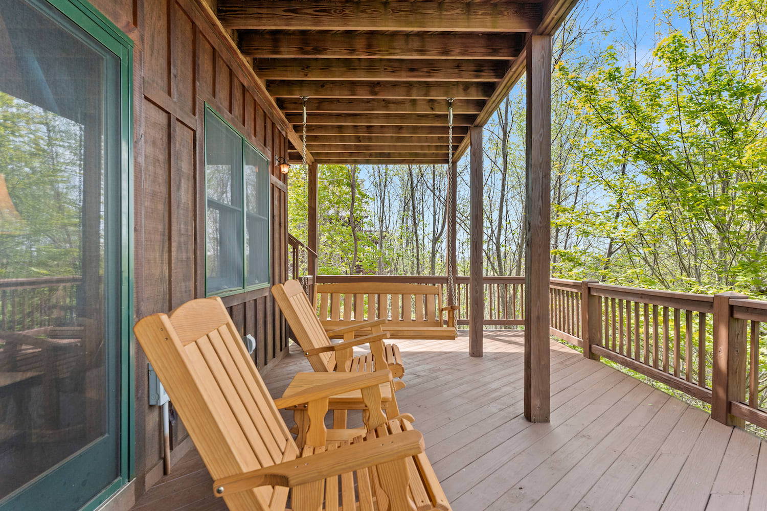 Cozy porch swing, chairs and a brand new hot tub