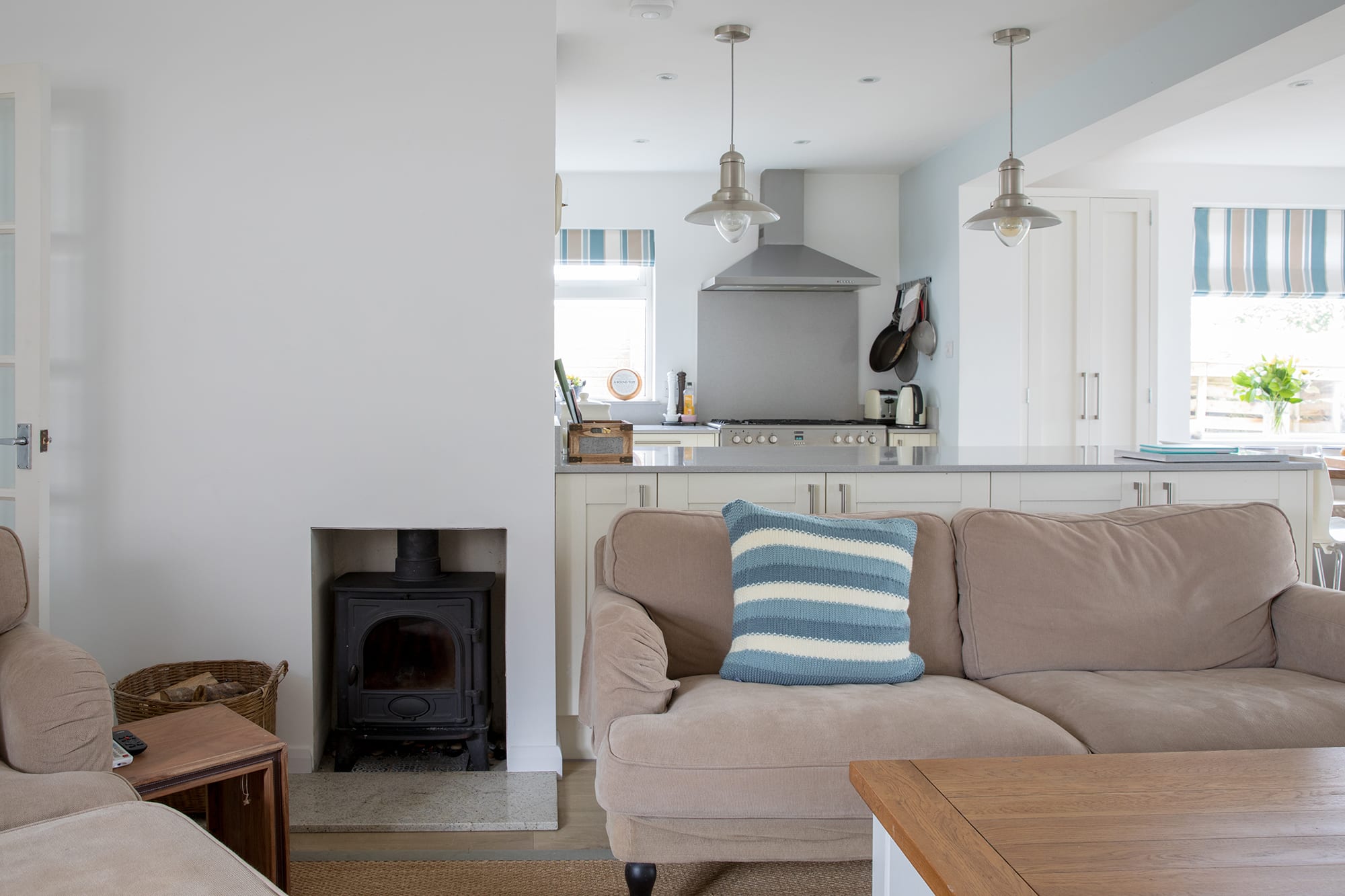 Charming wood-burning fireplace is a perfect gathering point during cold winter nights.