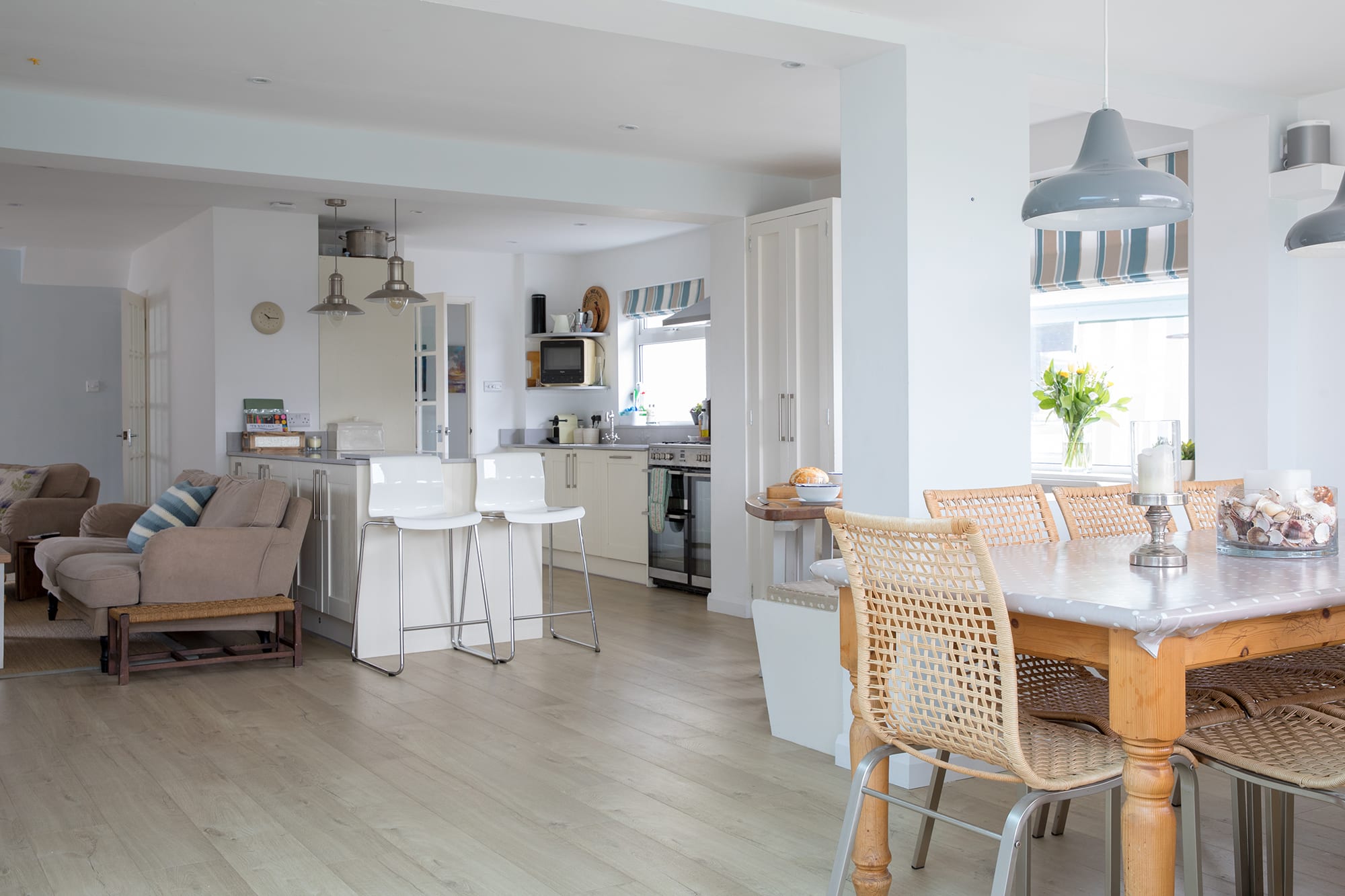 Abundance of healthy, natural light bursts through large windows.