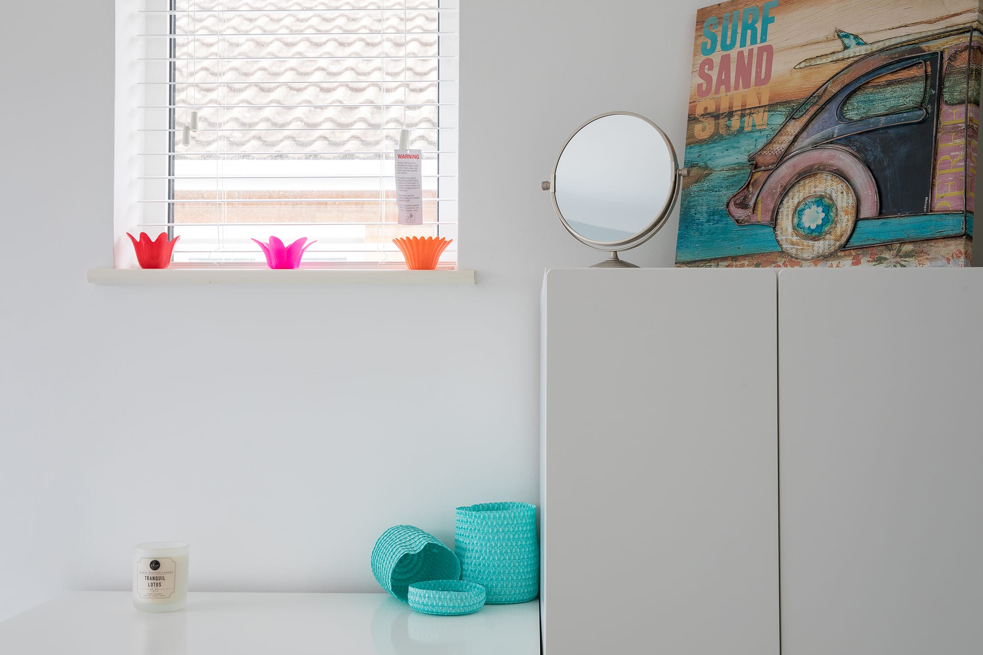 The monotone interior is tastefully accentuated by splashes of colour throughout.