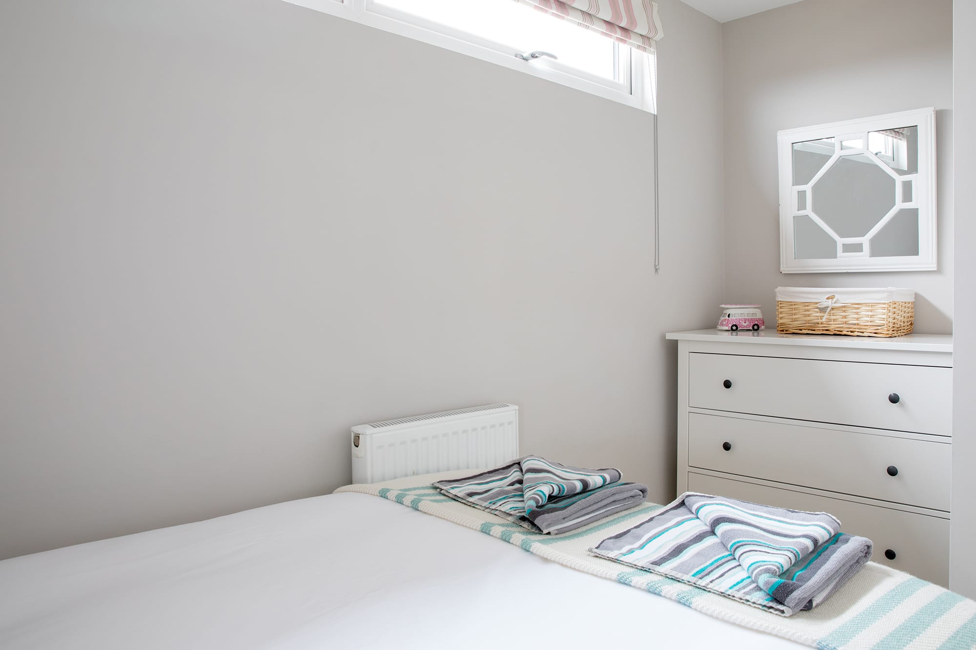 Store your clothes in the spacious dresser.