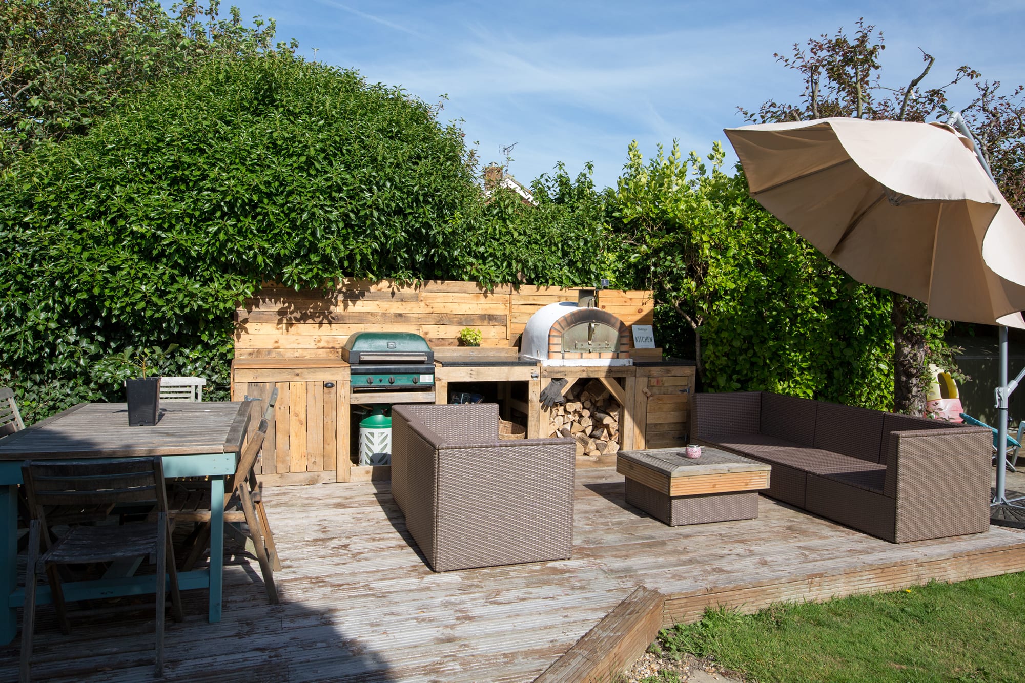 Fairy tale wooden deck in the private garden offers a sun-soaked setting for dining and relaxing. THIS BBQ HAS NOW BEEN REPLACED FOR A CHARCOAL BBQ