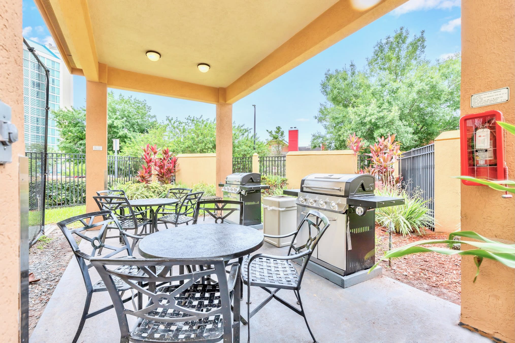 Outdoor Dining Area Featuring BBQ Grill And Comfortable Seating