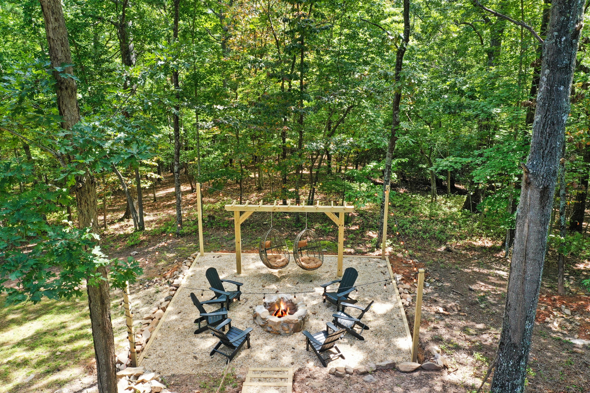 Enjoy the fire pit  pergola with 6 chairs and two swings!