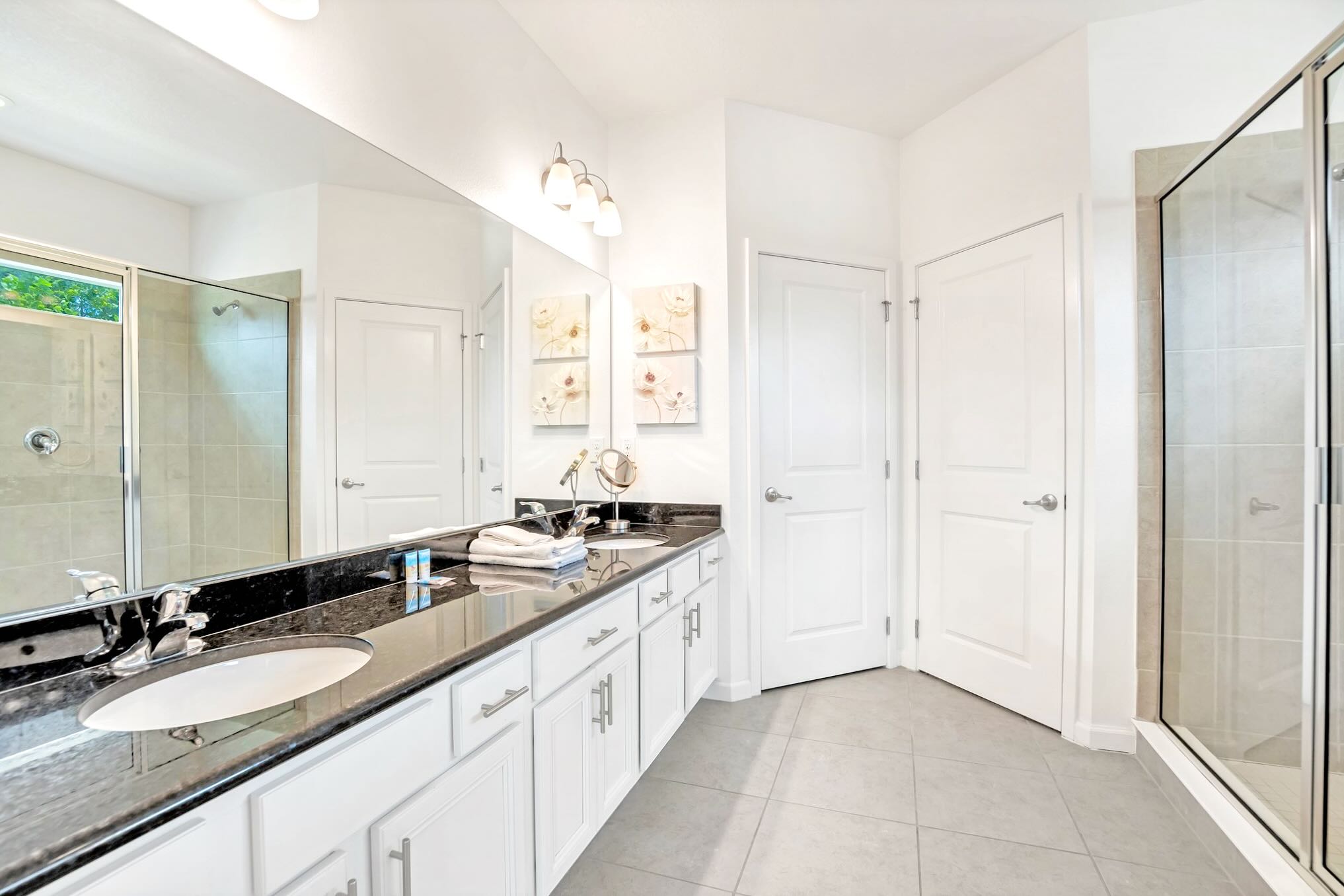 Luxurious Bathroom With Dual Sinks And Large Mirrors