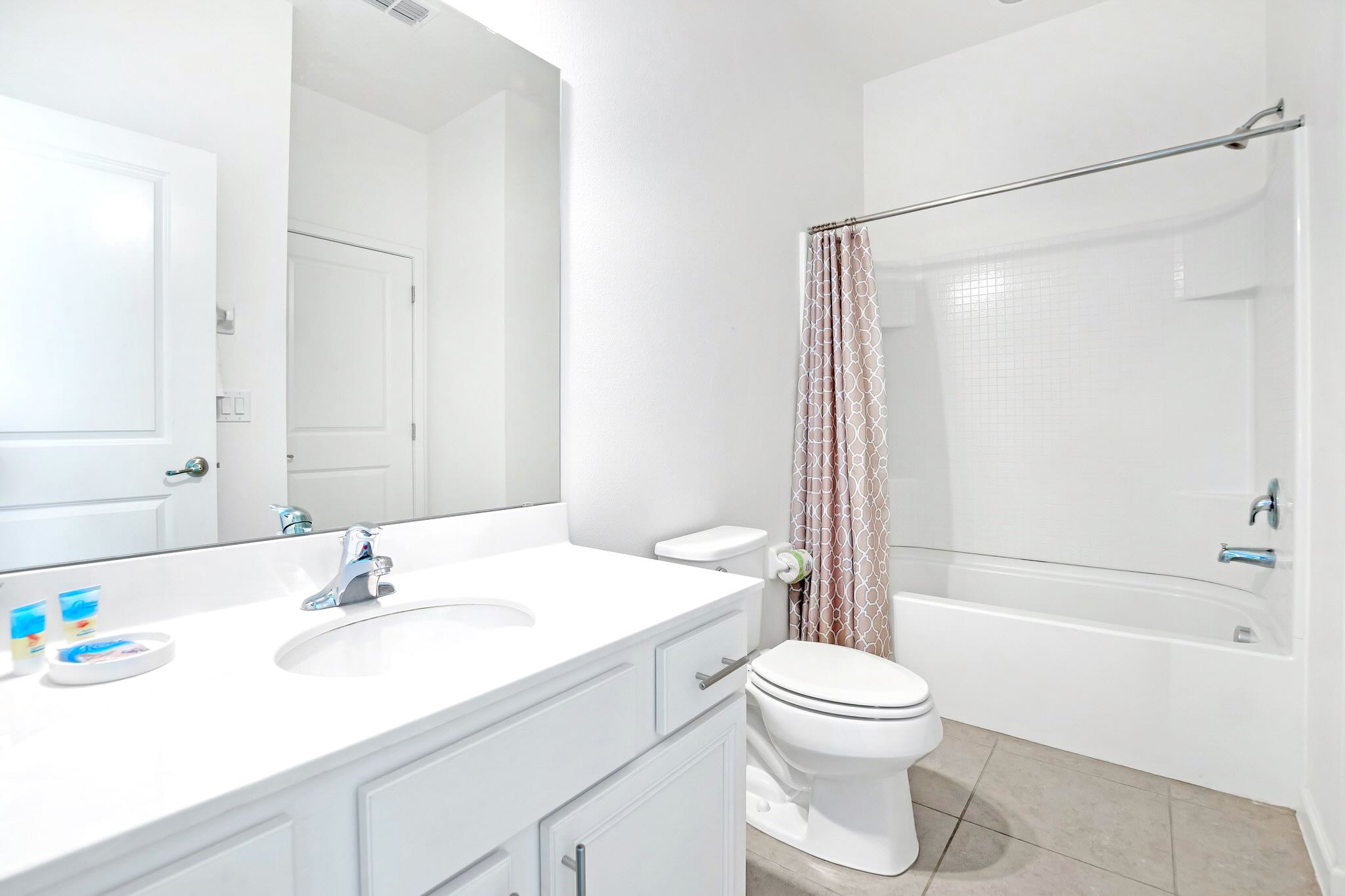 Bright Bathroom With Shower And Tub Combination