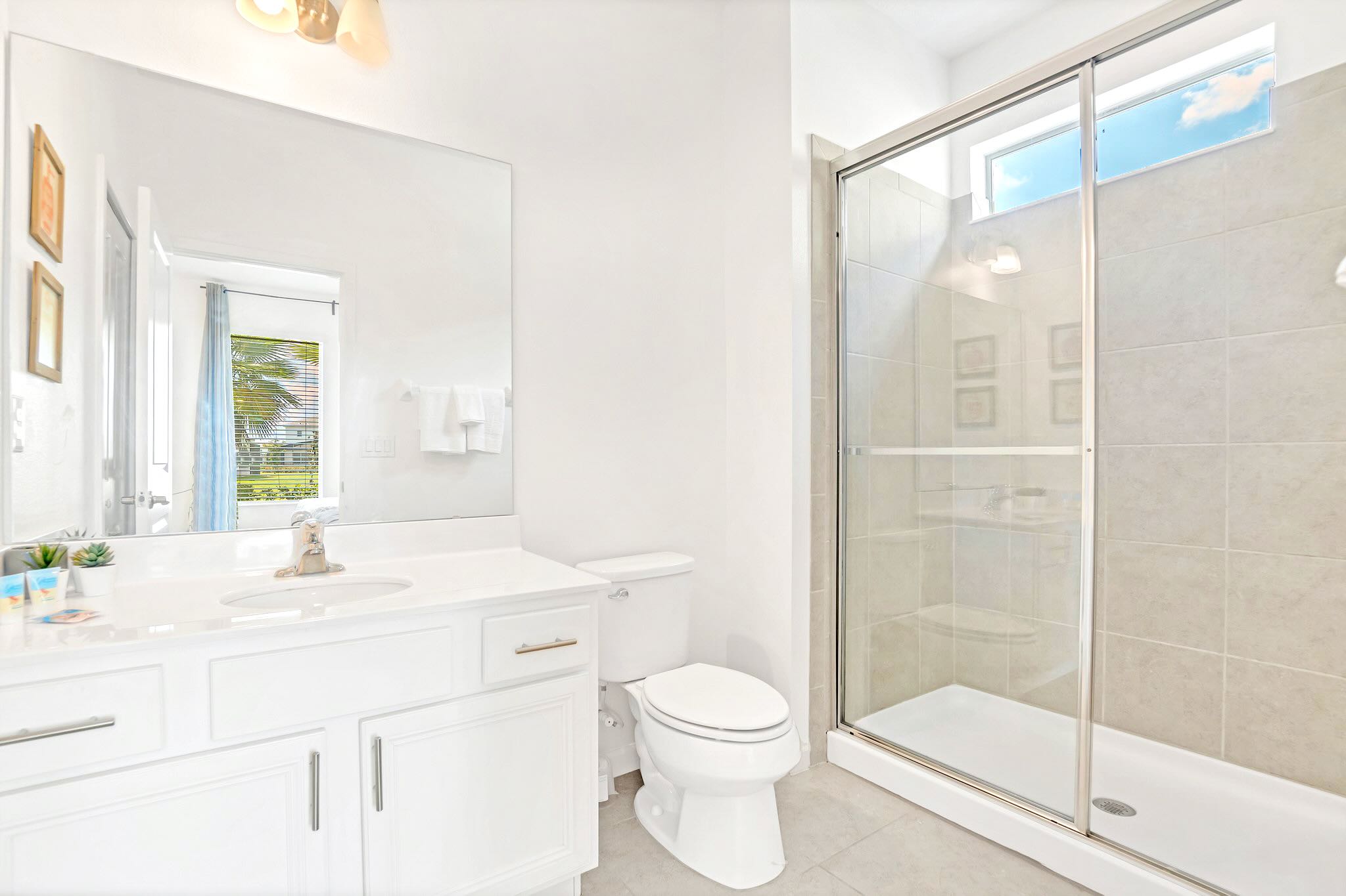 Modern Bathroom With Glass Shower And Bright Interior