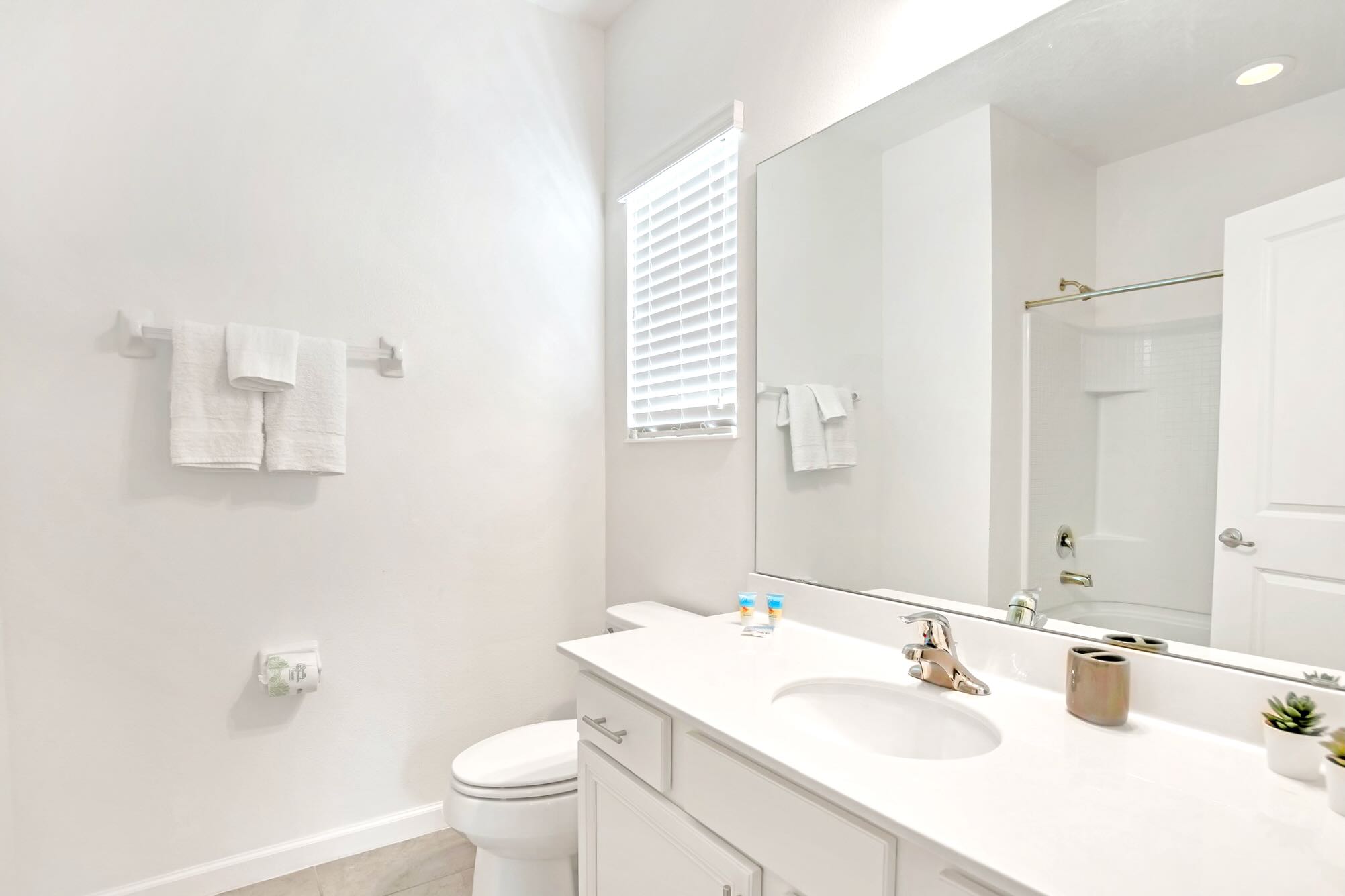 Bright Bathroom With Double Sinks And Ample Space