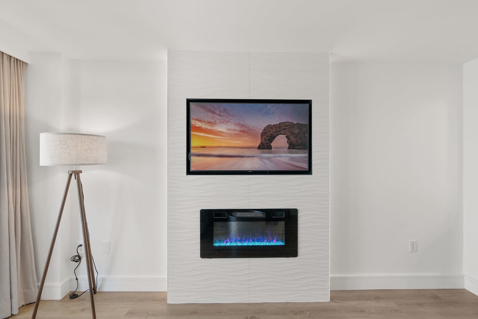 Cozy up by the electric fireplace and enjoy a movie night with stunning ocean views in the background.