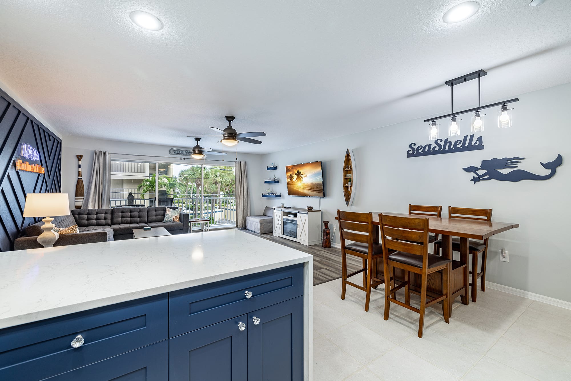 Open concept living, dining and kitchen with views of the beach!
