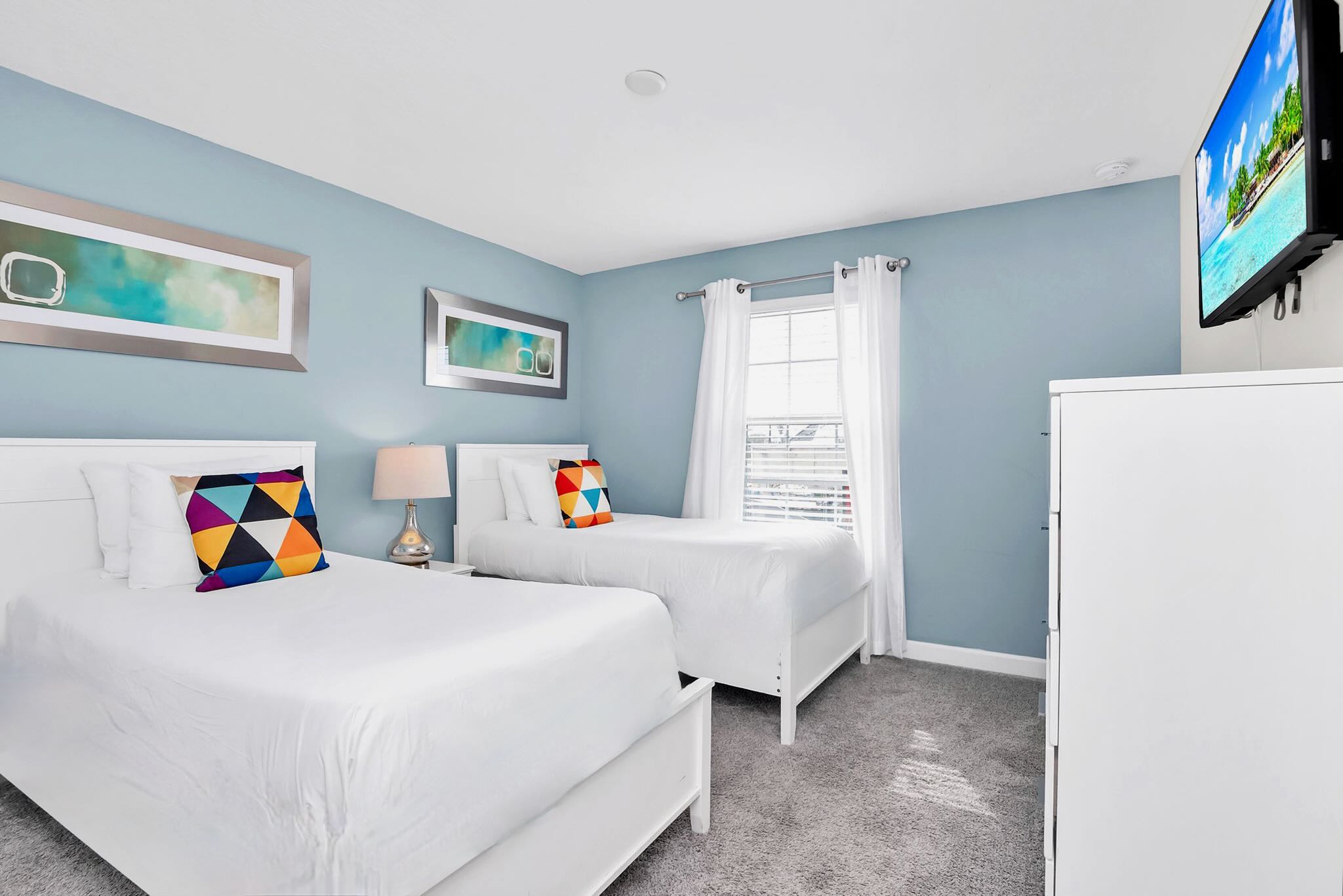 Bright Bedroom Featuring Two Beds And Stylish Decor